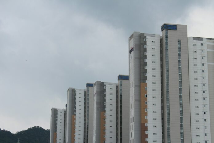 Photo by Drew Bae a group of tall buildings