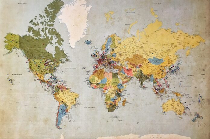 Photo by Andrew Stutesman blue, green, and yellow world map