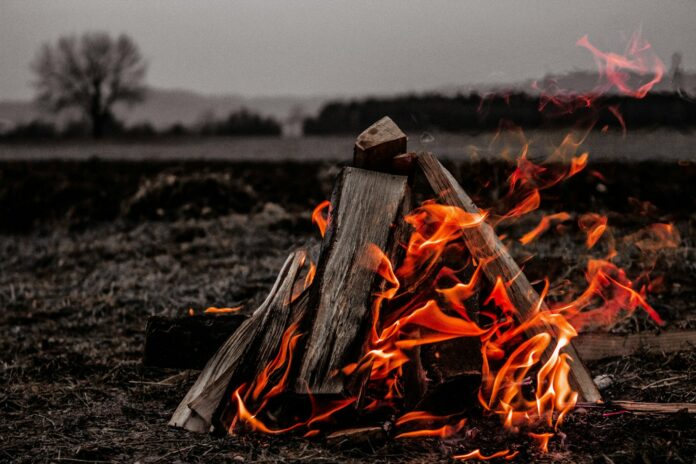 Photo by Marko Horvat brown bonfire on gray field