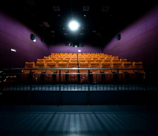 영화관람권·항공료 등에 붙는 18개 부담금 없앤다 orange and white chairs with lights turned on in a stadium