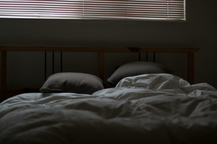 Photo by Quin Stevenson empty white and gray bed set