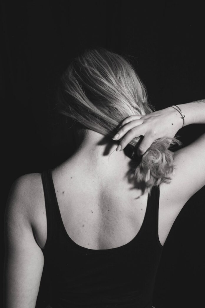 Photo by Matthew Moloney woman in black tank top