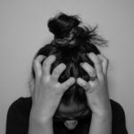 일상 속 스트레스 관리, 작지만 효과적인 새로운 습관이 뜬다 a woman covering her face with her hands