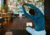 집콕 시대, 필라테스로 활력 찾기…일상 속 쉽게 시작하는 건강 루틴 a man doing yoga in a living room